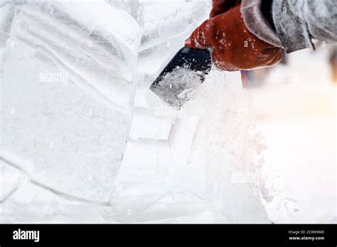 Ice sculpture carving man use chisel cut frozen winter Stock Photo - Alamy