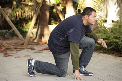 Man in a crouching pose — Stock Photo © felixtm #6036387