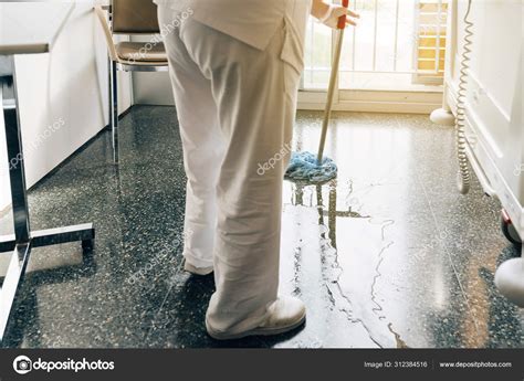 Concept photo of a hospital worker doing cleaning in the room Stock ...