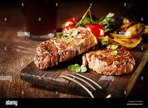 Thick tender roasted or grilled beef fillet medallions served on an old ...