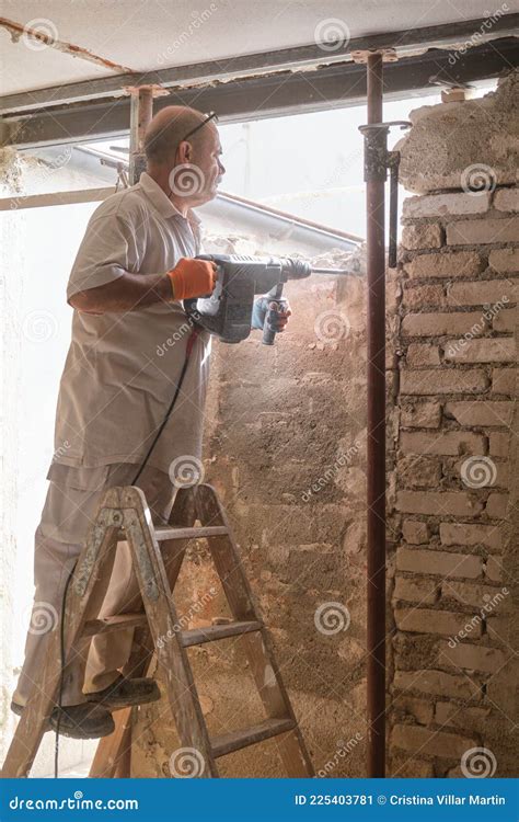 Builder with Demolition Hammer Breaking a House Wall. Stock Image - Image of destroy, worker ...