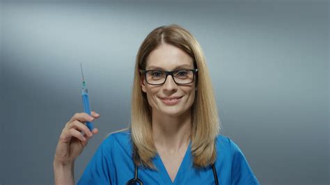 Free stock video - Portrait of the young blond beautiful woman physician in the glasses holding ...