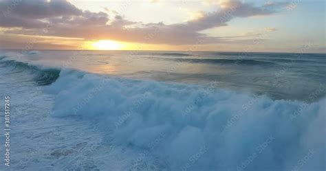 Wide aerial, sunset over ocean waves in Hawaii vídeo do Stock | Adobe Stock