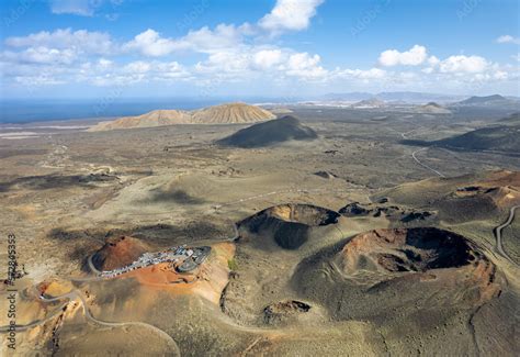 The drone aerial view of volcanoes in the Timanfaya natural park, Lanzarote, Spain. Timanfaya ...