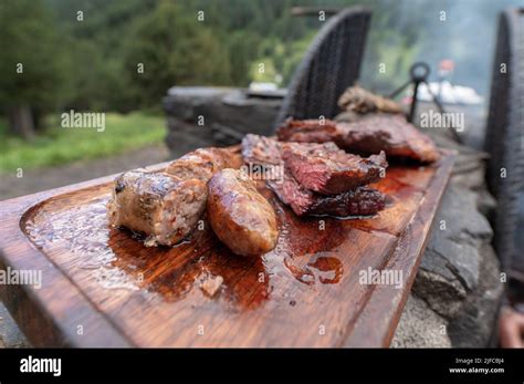 Typical Uruguayan and Argentine Asado Cooked on fire. Entrana and Vacio ...