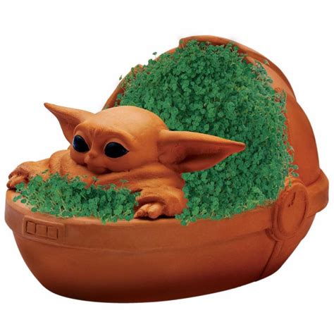 An Adorable Baby Yoda Chia Pet in a Floating Crib