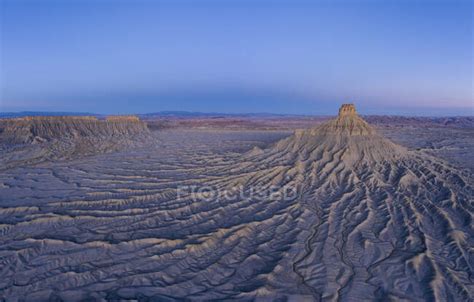 Erosion paints an abstract picture in the hills surrounding factory butte — destination, desert ...