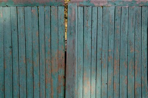 Premium Photo | Old painted wooden gate.