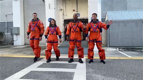 Artemis 2 crew walks out of historic NASA building in launch dress ...