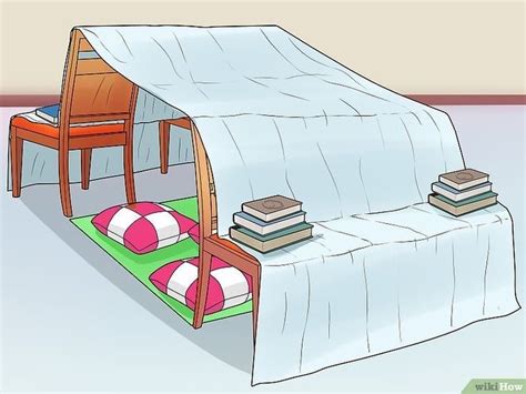 a bed with a cover over it and some books on the floor next to it