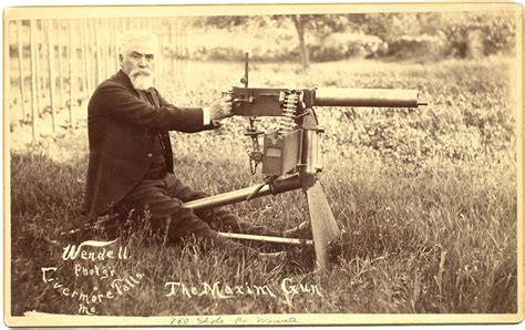 Hiram Maxim posing with his invention, The Maxim Gun, the world's first fully automatic machine ...