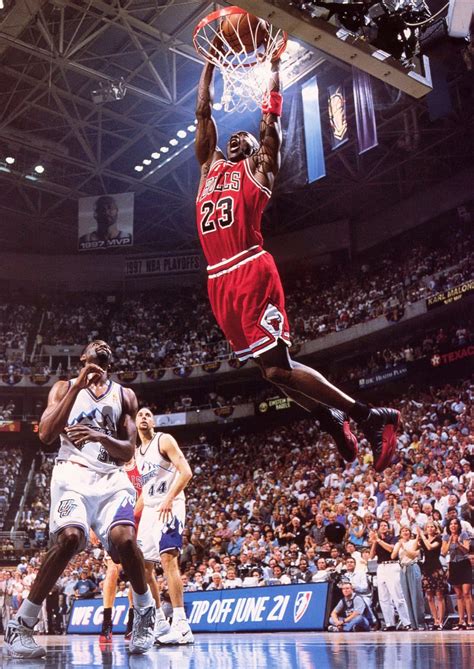 Download Michael Jordan in Mid-Air Slam Dunk Wallpaper | Wallpapers.com