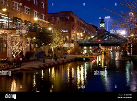 USA, Oklahoma, Oklahoma City, River Walk along Bricktown Canal at dusk ...