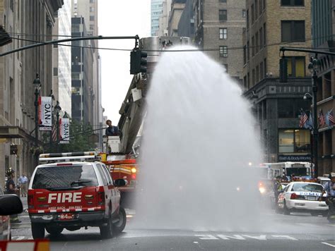 WATCH: 'Torrential Downpour' In Chicago Causes Rare Sidewalk Geysers | iHeart