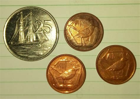 A few Cayman Islands coins. Two 2005 and 1999 one cent and 1996 25 ...