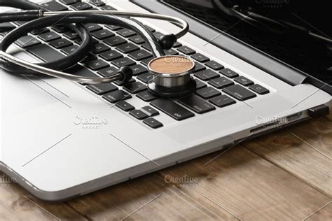 a stethoscope on top of a laptop keyboard