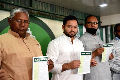 RJD leader Tejashwi Yadav along with other party members addressing ...