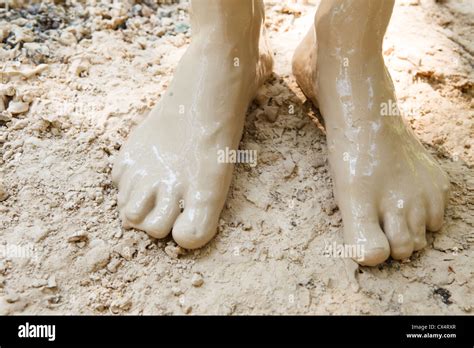 Feet in mud close-up Stock Photo - Alamy