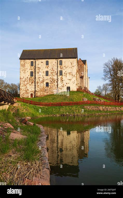 Medieval Kastelholm Castle and its reflections on a calm river in Åland ...