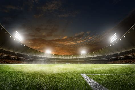 Empty night grand soccer arena in lights – SportsTravel