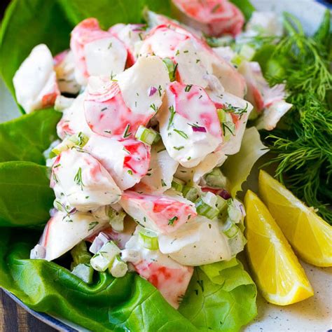 crab salad with lemon wedges and dill