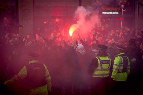 PSG football fans set off fireworks and flares in the city centre ...