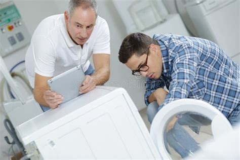 Repair of washing machine stock image. Image of vocational - 117901585