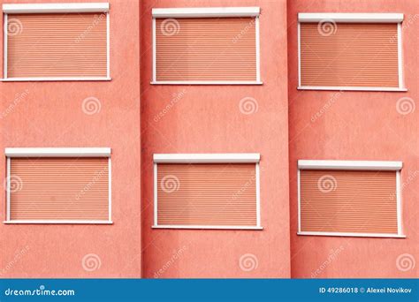 Red Building Facade with Six Closed Windows Shutters Stock Photo - Image of outside, outer: 49286018