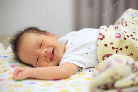 Newborn baby sleep and smile — Stock Photo © blanscape #128197466