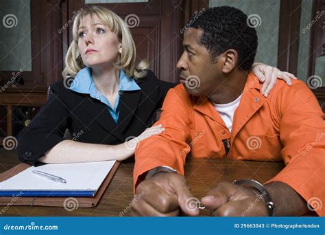 Female Lawyer With Criminal In Courtroom Stock Photos - Image: 29663043