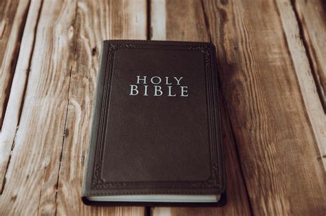 Premium Photo | Holy bible on the wooden background