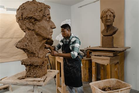 A Man Looking at a Clay Sculpture · Free Stock Photo