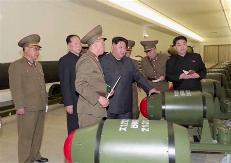 North Korea unveils new nuclear warheads as US air carrier arrives in ...