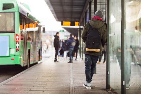 Man waiting at bus stop — transportation, connection - Stock Photo ...