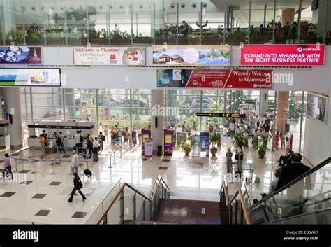 Passengers at Arrivals, terminal interior, Yangon international Airport, Yangon ( Rangoon ...