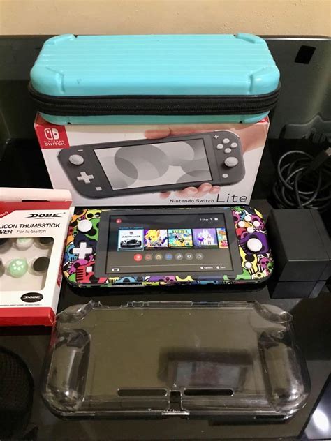 Nintendo switch lite with games, Video Gaming, Video Game Consoles ...