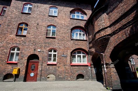 Old brick house in historical district of the city – Stock Editorial Photo © Radiokafka #53310641