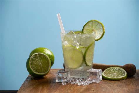 Premium Photo | Glass of caipirinha typical brazilian drink on a wooden ...