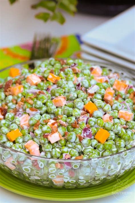 Classic Pea Salad made with thawed peas, cheese, bacon and red onion, then tossed in a creamy ...