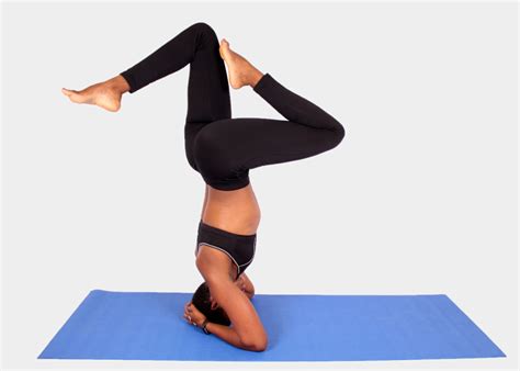 Athletic Woman Doing Headstand Yoga Pose