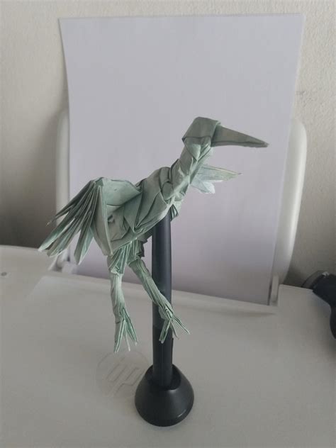 Dancing crane designed by Robert J. Lang and folded by me on painted baking paper : r/origami