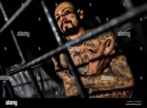 A local leader of the Mara Salvatrucha gang (MS-13) shows a hand sign ...