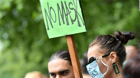 London face mask protests: Hundreds of people, some wearing masks, protested against mask ...