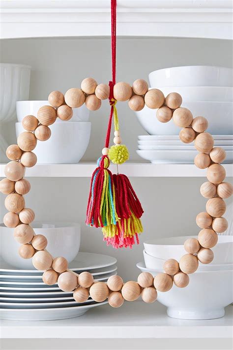 This DIY Beaded Wreath is So Easy To Make | Wood beads diy, Wooden bead ...