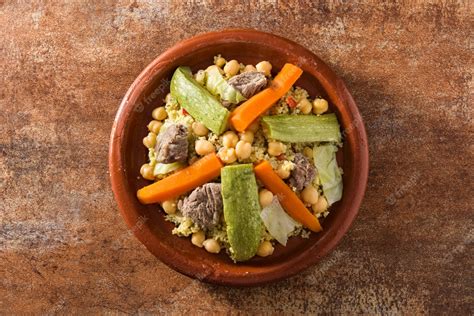 Premium Photo | Traditional tajine with vegetables, chickpeas, meat and couscous