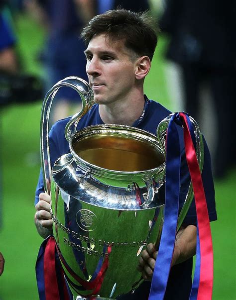 BERLIN, GERMANY - JUNE 06: Lionel Messi of Barcelona holds the trophy during the UEFA Champions ...