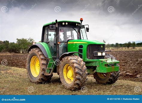 Green tractor. editorial image. Image of harvesting, editorial - 65114745