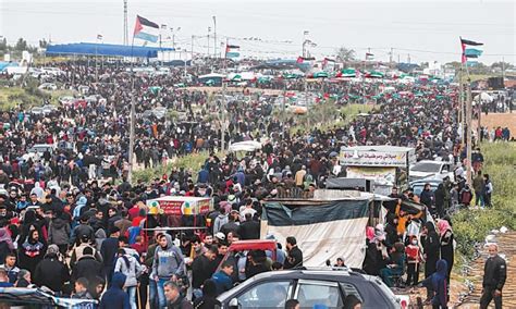 Tens of thousands mass at Gaza border to mark protest anniversary ...