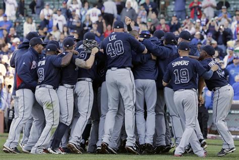 Atlanta Braves players and coaches celebrate after the Braves defeated ...