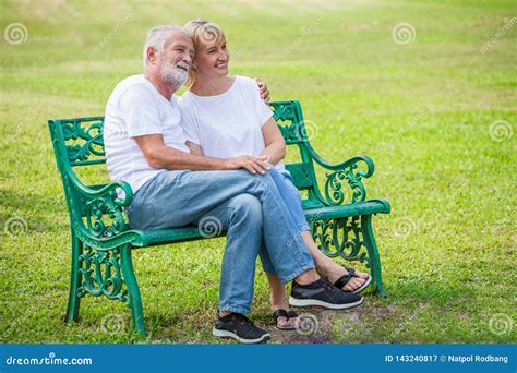 Happy Senior Loving Couple Relaxing at Park Embracing Together in Morning Time. Old People ...